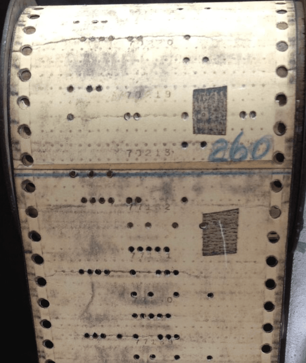 Vintage patch board with tape over two holes